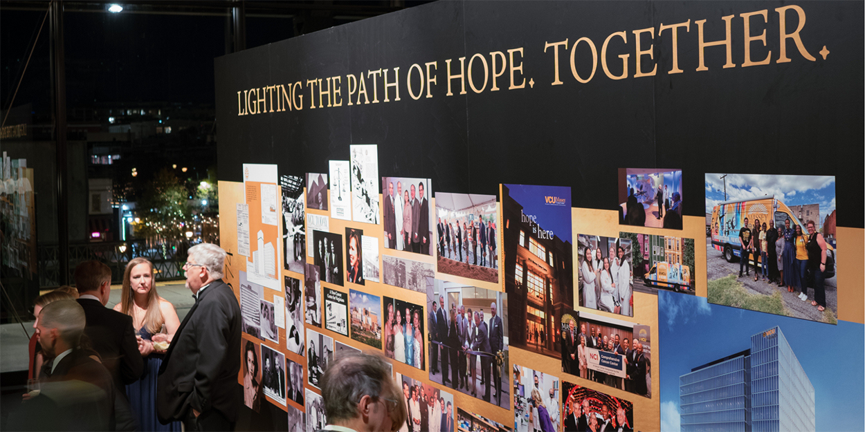 Large wall showcasing Massey's history, displaying the phrase: Lighting the Path of Hope, Together.